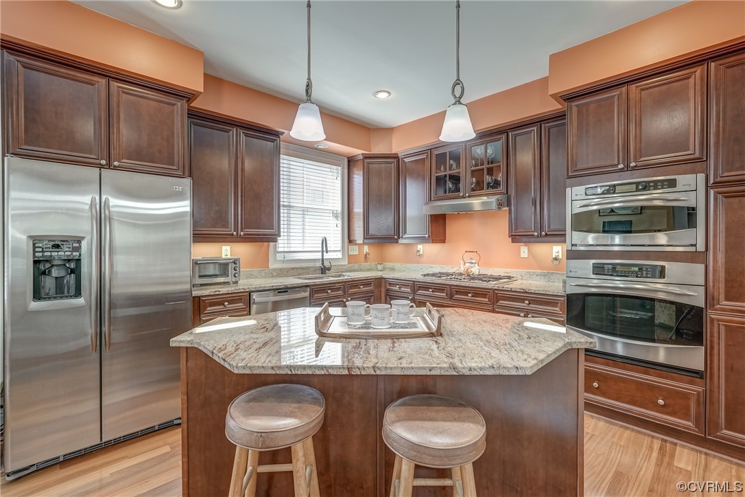 116 Cedar Works Row Richmond, VA 23231 - Photo 3 of 21 a kitchen with stainless steel appliances granite countertop a sink refrigerator and cabinets