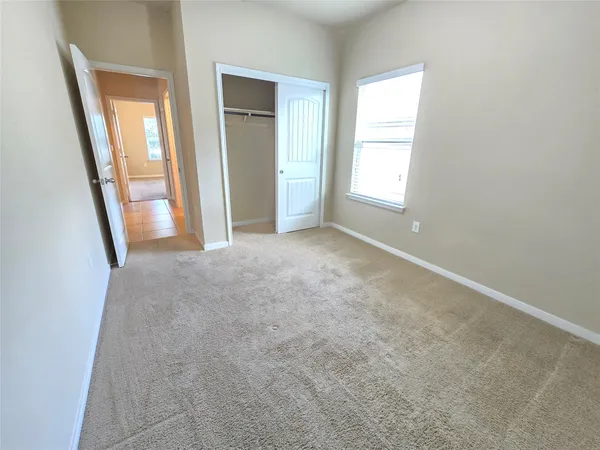 a view of a bathroom from a corridor