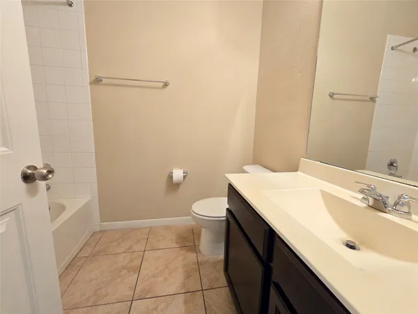 an empty room with closet and bathroom