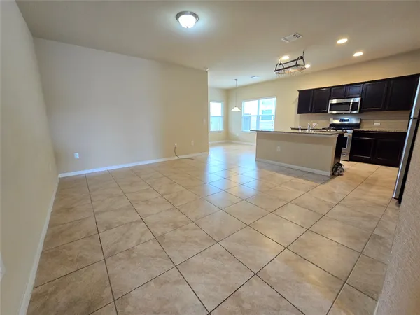 a kitchen with a sink a stove and microwave