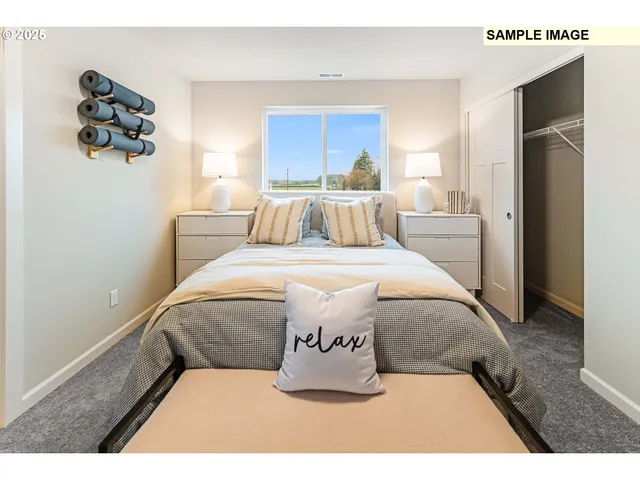 a bed room with a bed and a night stand