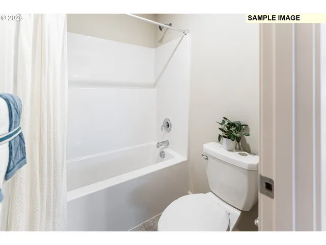 a bathroom with a toilet a sink and a bathtub