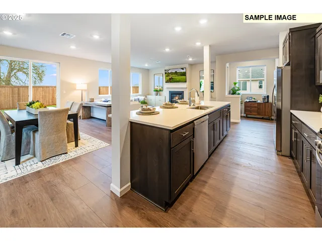 a large kitchen with lots of counter space and a sink