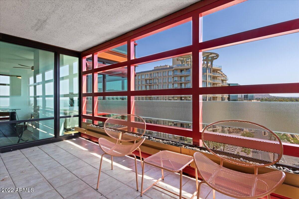 4808 North 24th Street, Unit 1007 Phoenix, AZ 85016 - Photo 14 of 19 a room with gym equipment and a large window