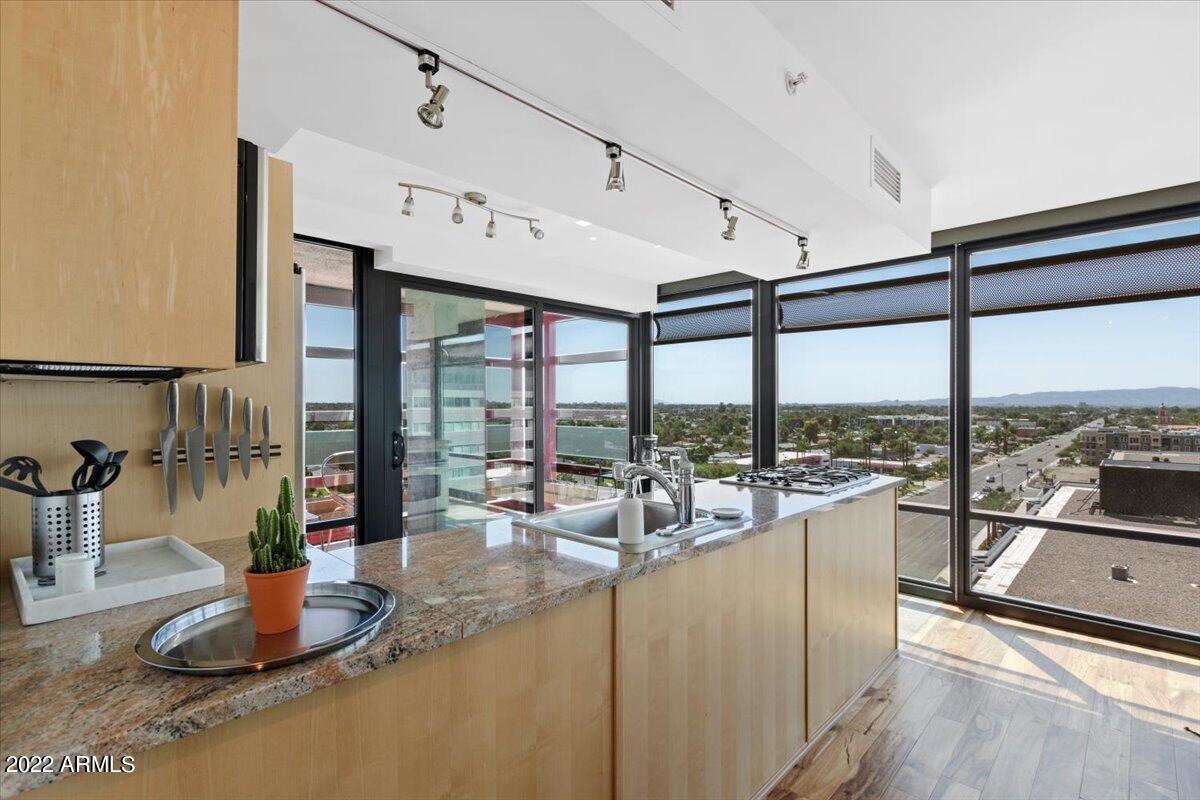 4808 North 24th Street, Unit 1007 Phoenix, AZ 85016 - Photo 5 of 19 a living room with hard wood floor