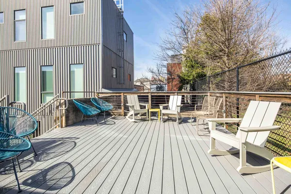 a view of a backyard with wooden floor