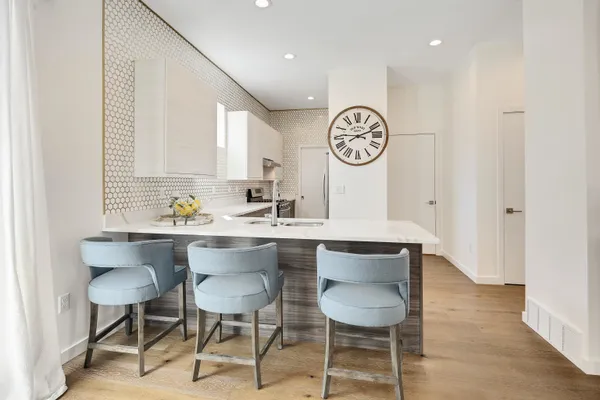 a kitchen with a table and chairs in it