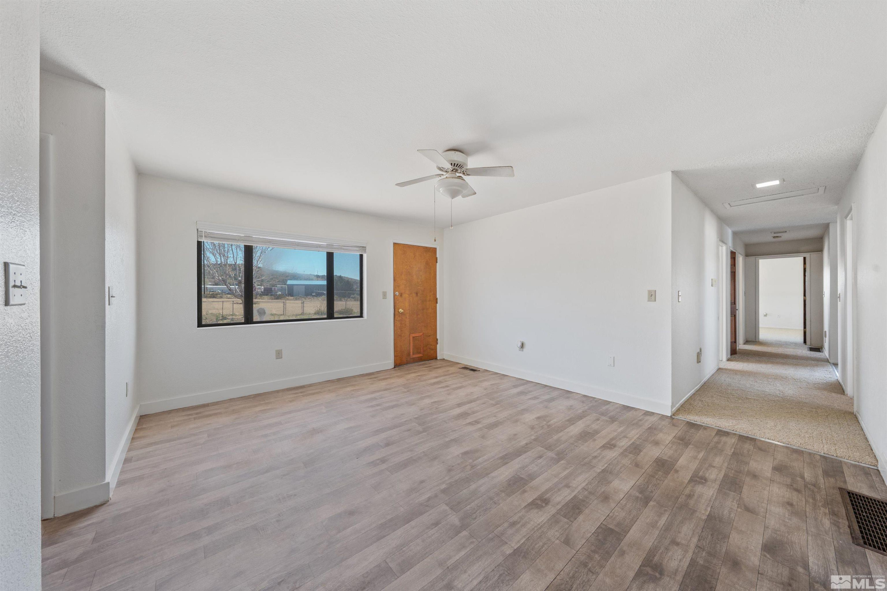 9320 Arrowhead Way Reno, NV 89506 - Photo 13 of 39 a view of an empty room with a window