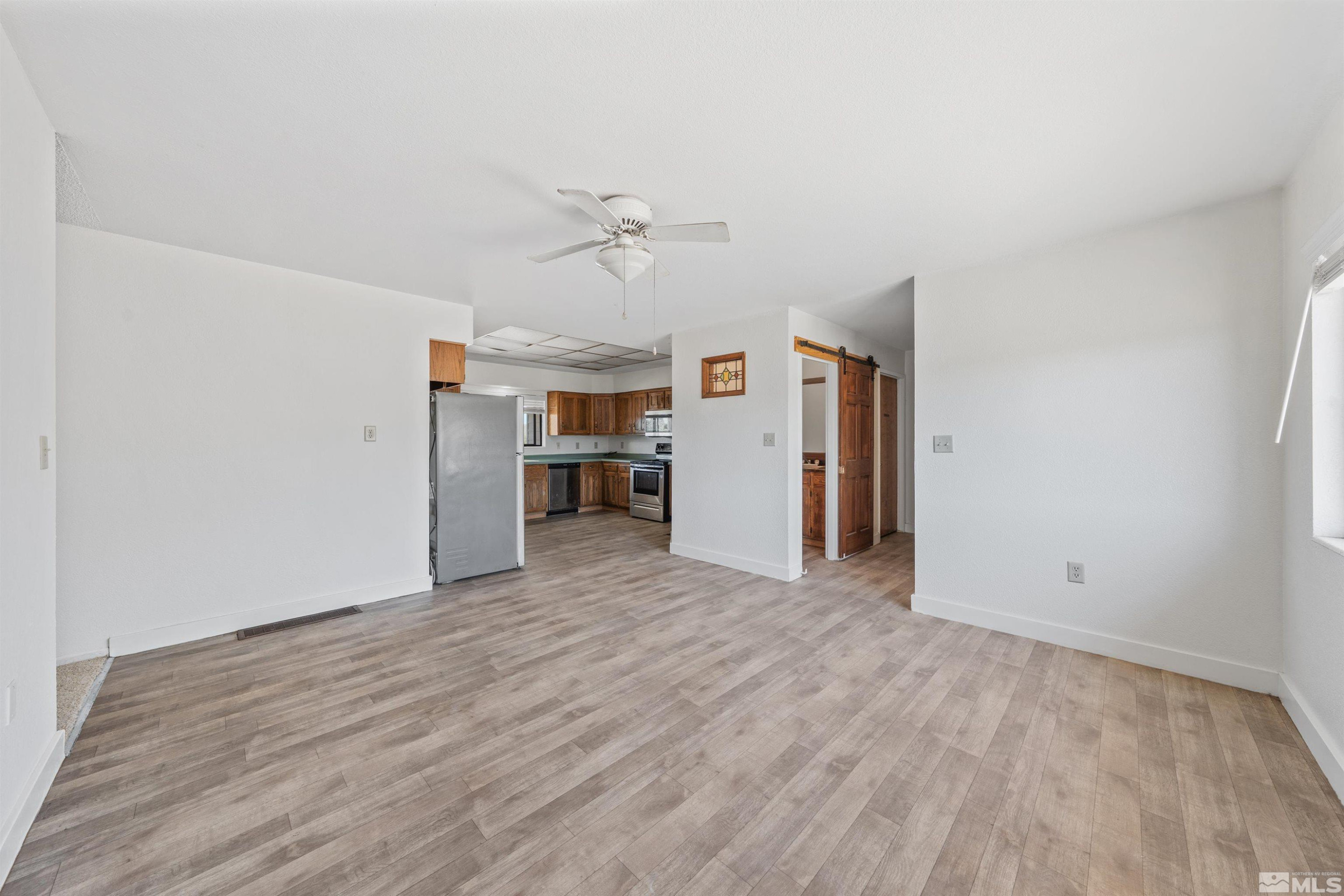 9320 Arrowhead Way Reno, NV 89506 - Photo 14 of 39 a view of empty room with wooden floor
