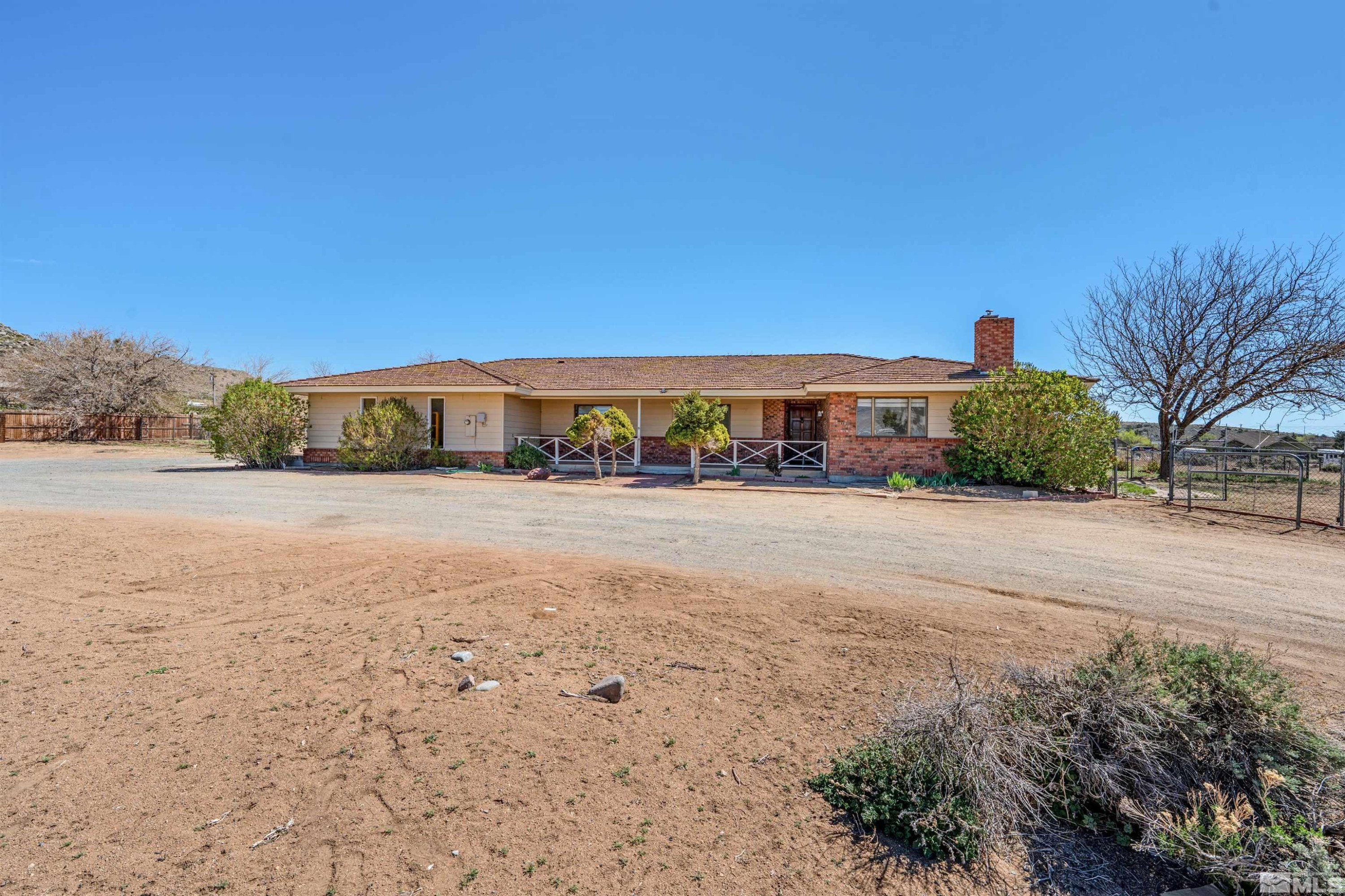 9320 Arrowhead Way Reno, NV 89506 - Photo 2 of 39 a view of house with yard and mountain view in back