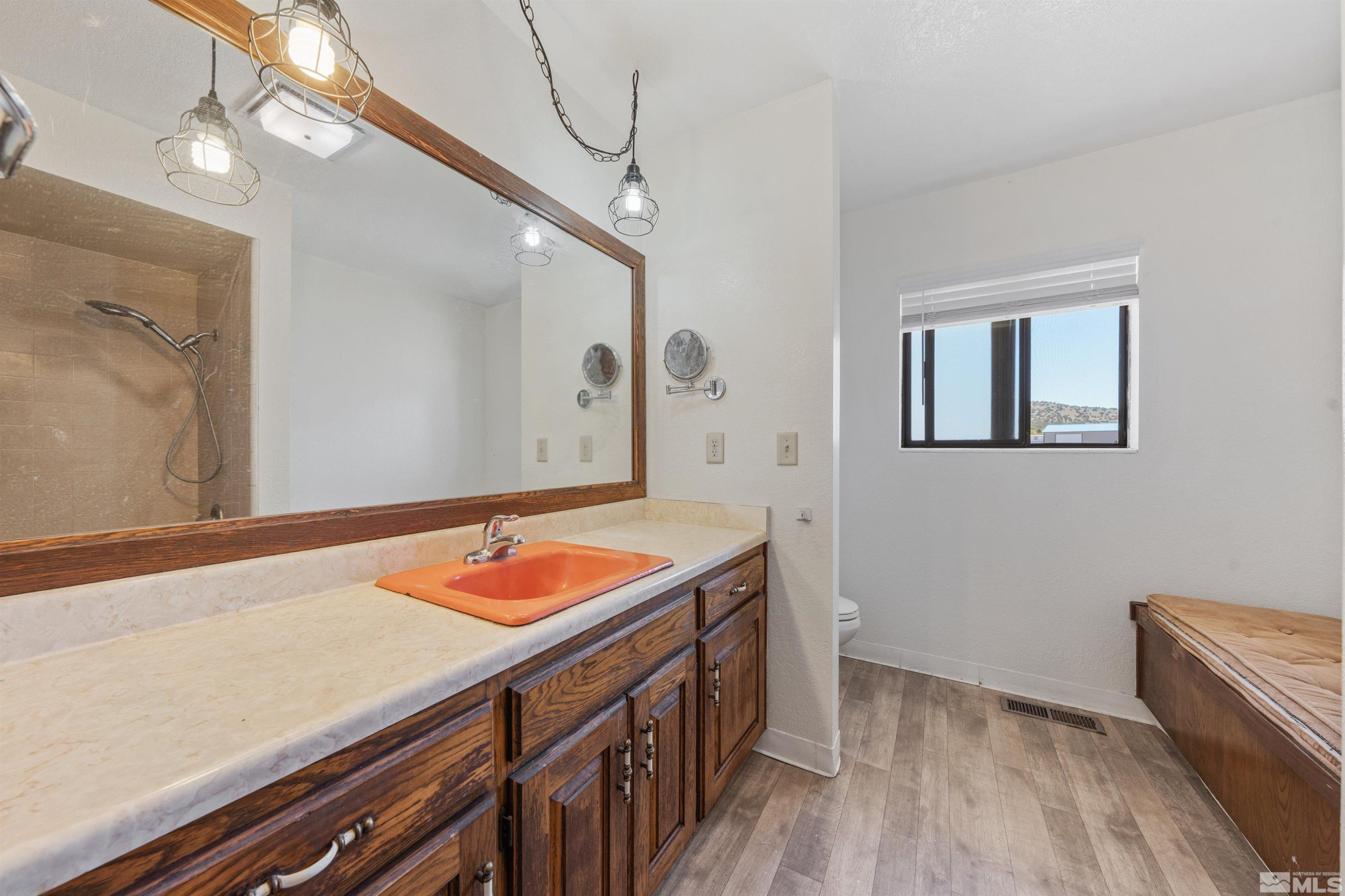 9320 Arrowhead Way Reno, NV 89506 - Photo 21 of 39 a bathroom with a sink and a mirror