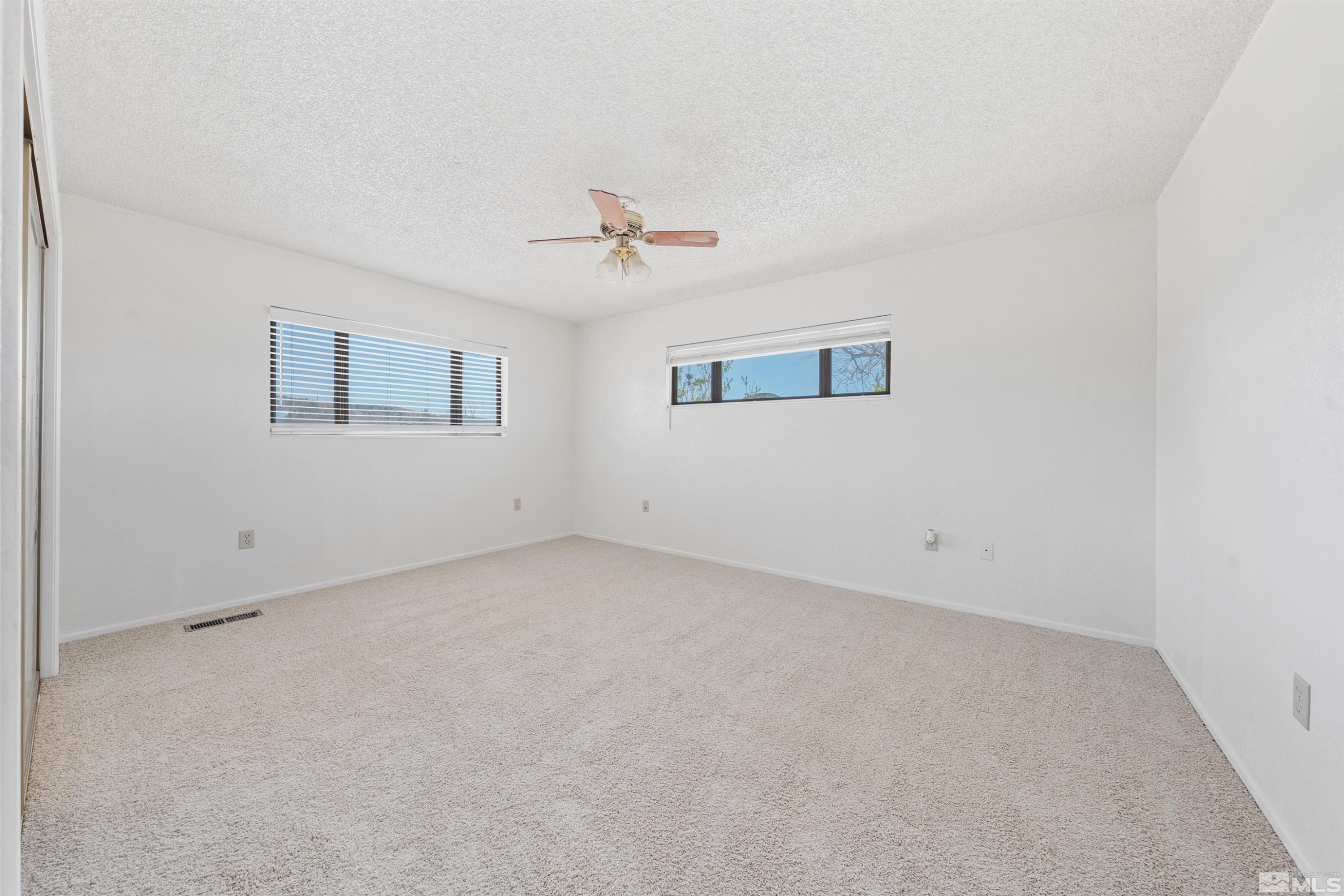 9320 Arrowhead Way Reno, NV 89506 - Photo 23 of 39 a view of an empty room with a window