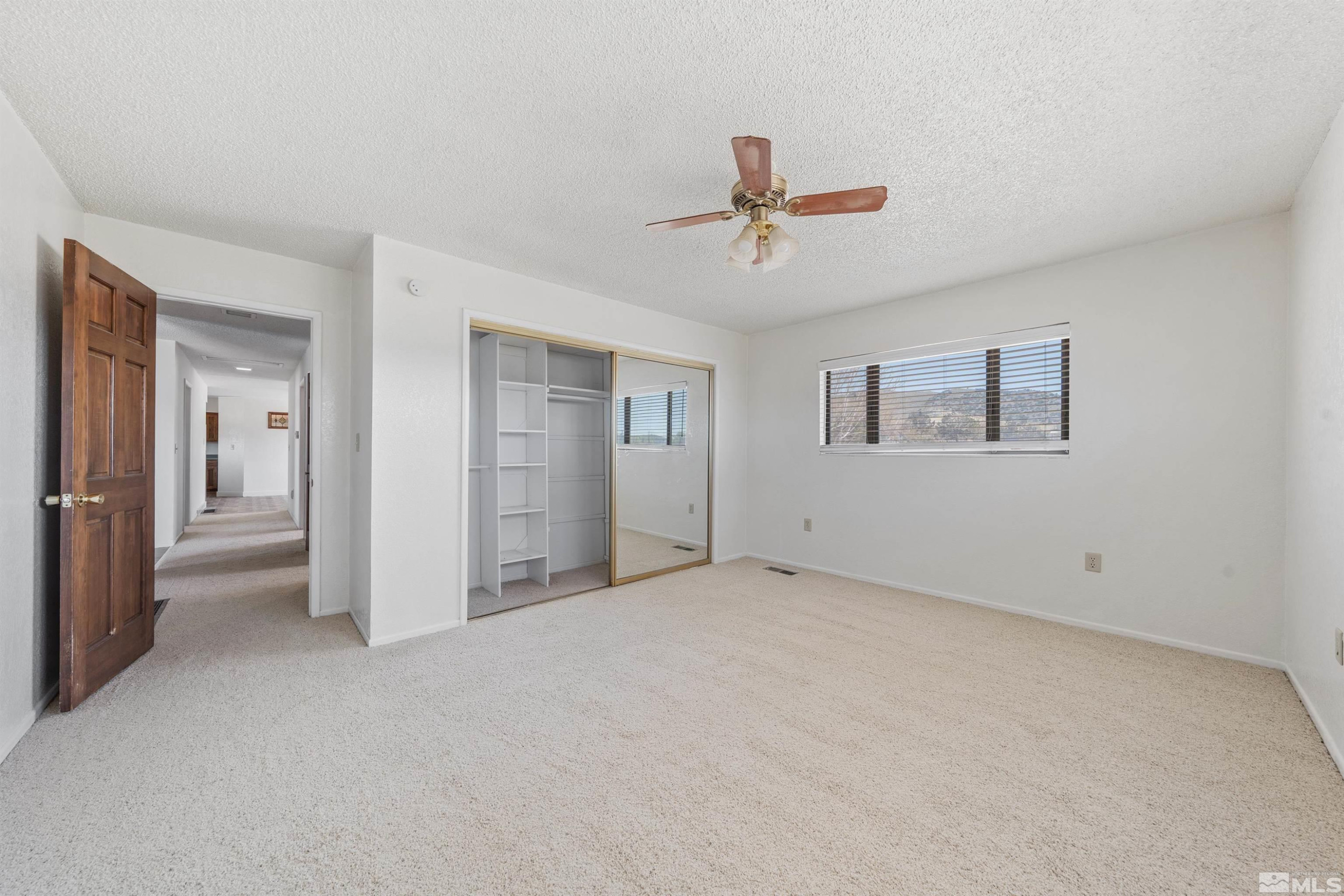9320 Arrowhead Way Reno, NV 89506 - Photo 24 of 39 a view of an empty room with a window