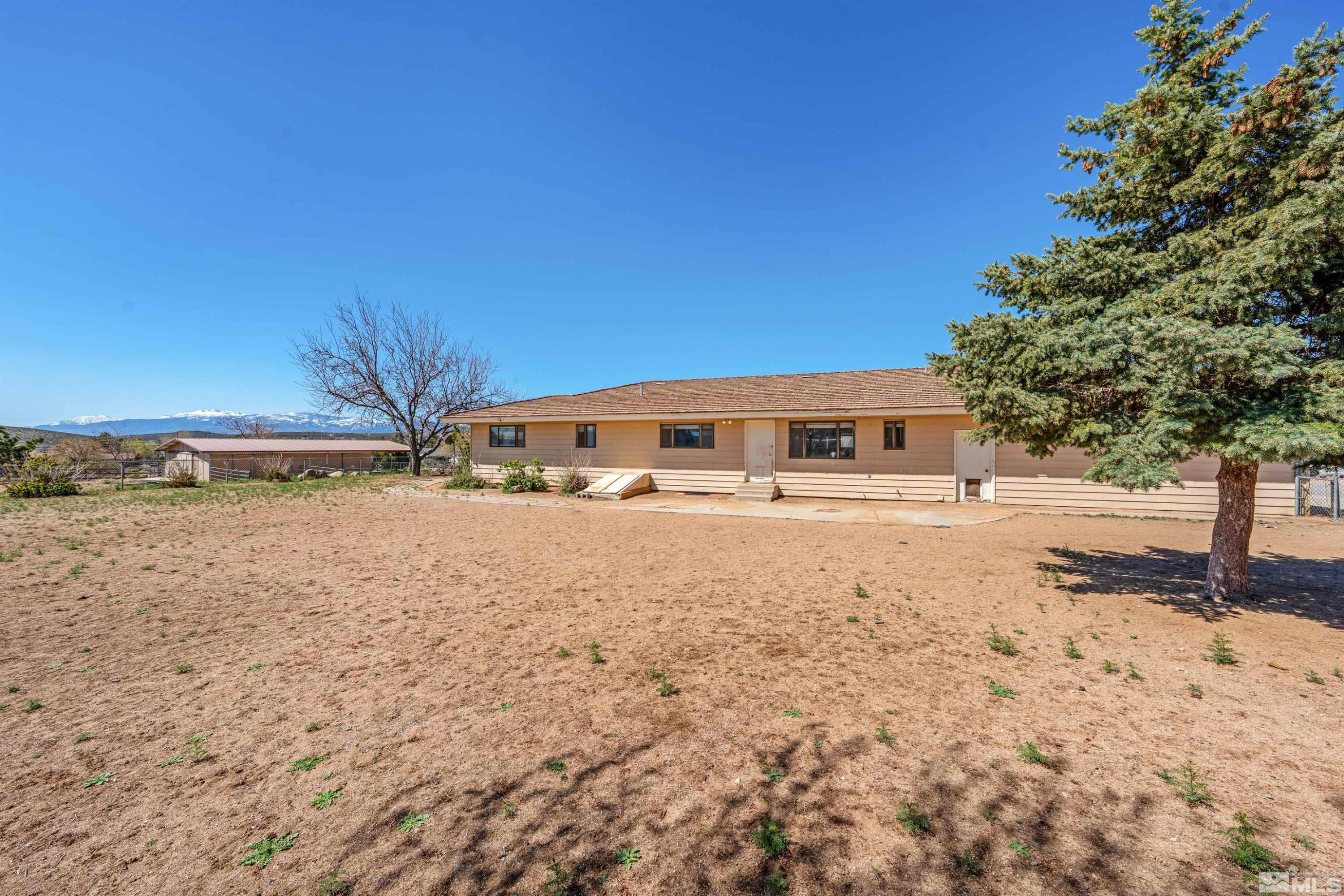 9320 Arrowhead Way Reno, NV 89506 - Photo 37 of 39 a front view of a house with a yard