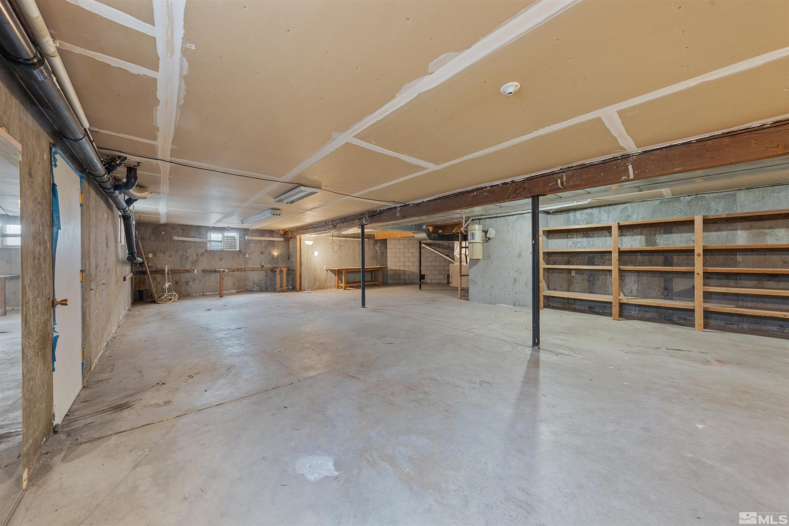 9320 Arrowhead Way Reno, NV 89506 - Photo 38 of 39 a view of empty room with wooden floor and windows