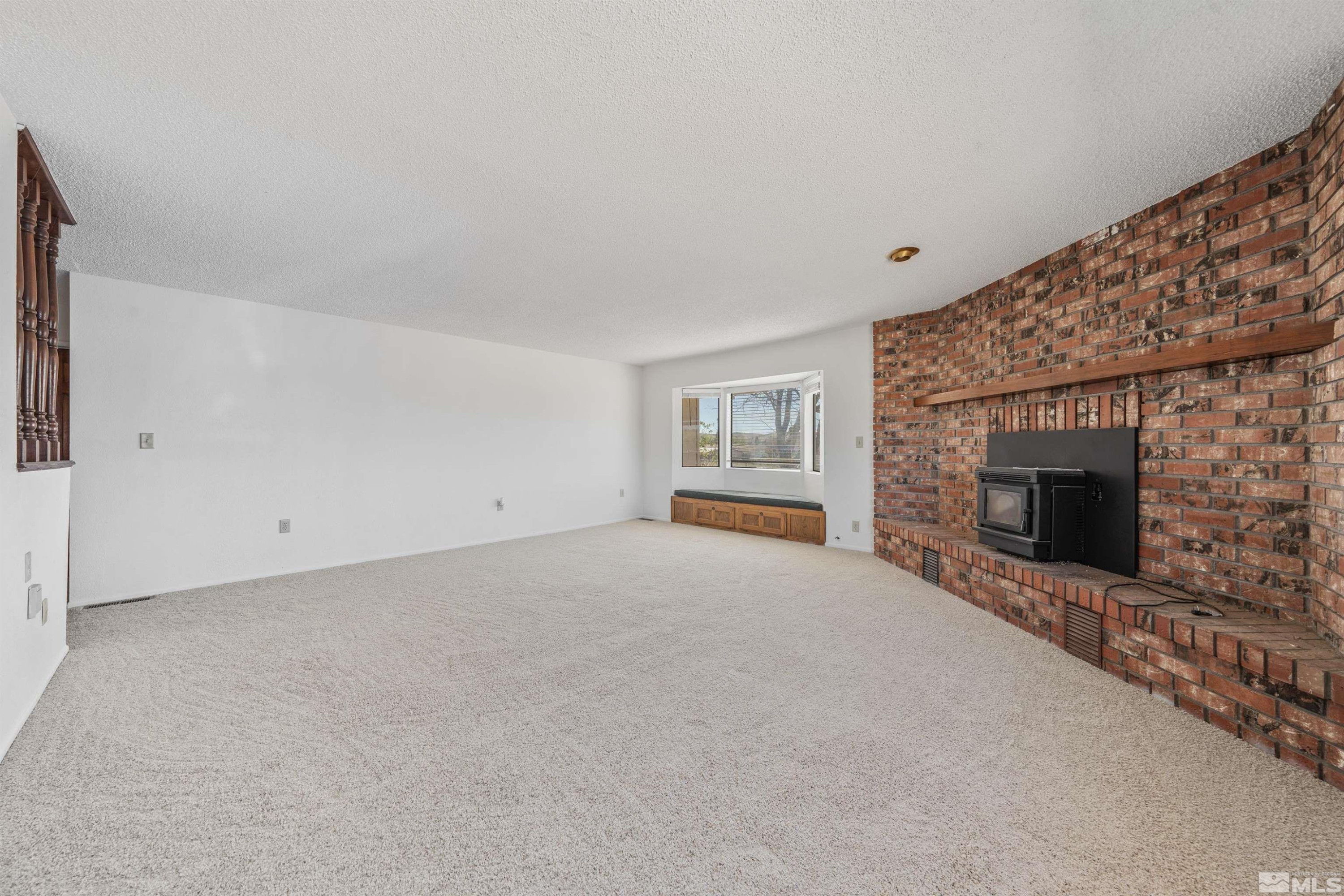 9320 Arrowhead Way Reno, NV 89506 - Photo 5 of 39 a living room with furniture and a fireplace