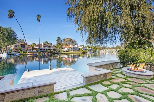 a lake view with a table and chairs