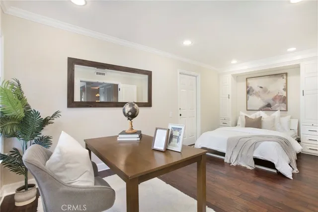 a bedroom with a bed and a table