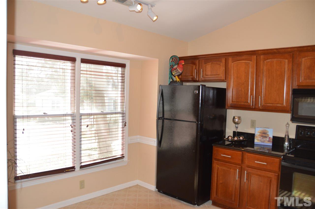 1514 Ferncliff Circle Raleigh, NC 27609 - Photo 4 of 18 a kitchen with stainless steel appliances a refrigerator and a sink