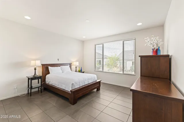 a living room with furniture and painting on the wall
