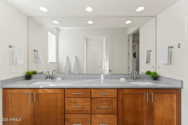 a bedroom with a bed and wall painting