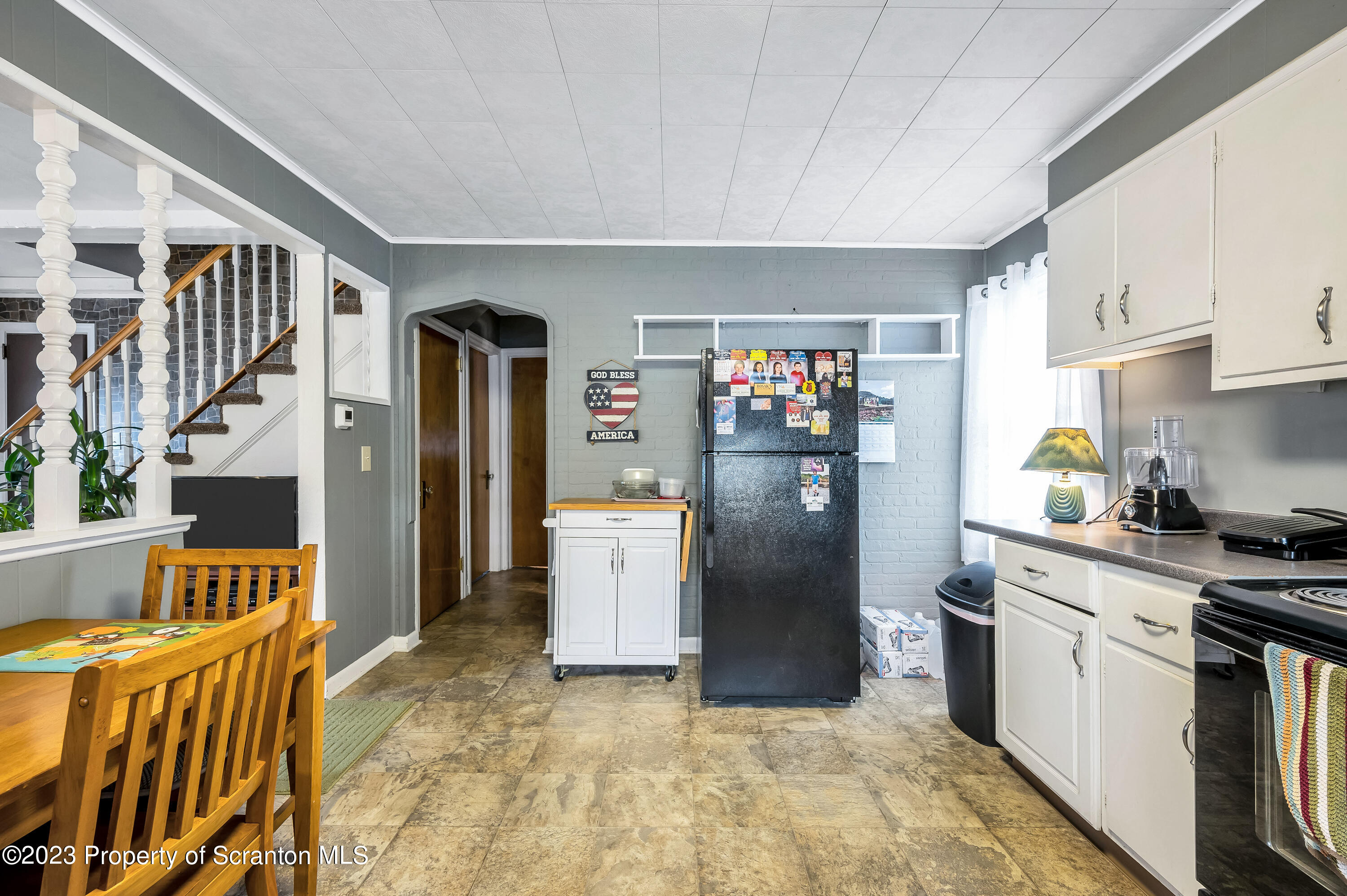 709 Meade Street Throop, PA 18512 - Photo 11 of 37 a kitchen with stainless steel appliances granite countertop a refrigerator a stove and a sink