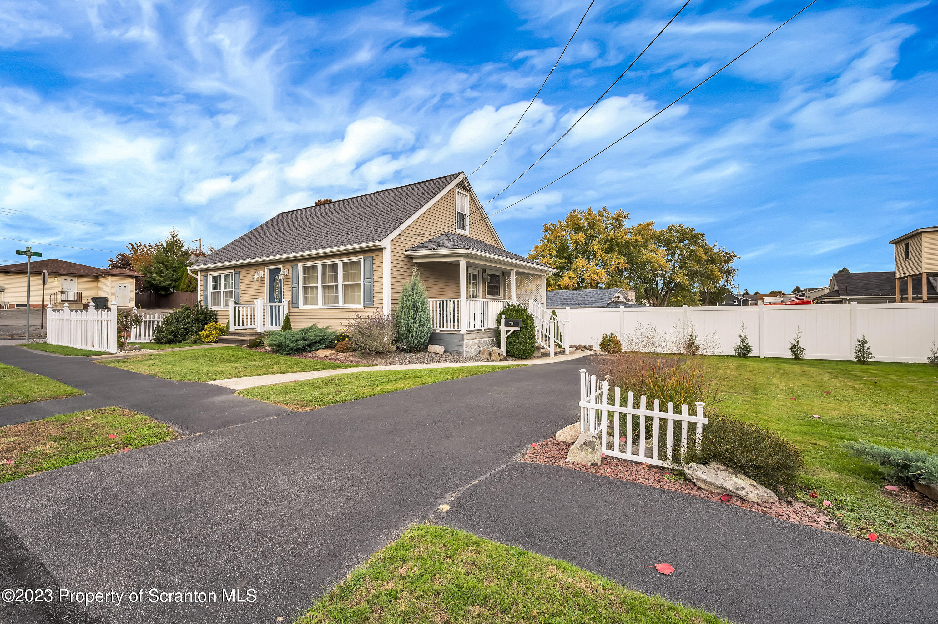 709 Meade Street Throop, PA 18512 - Photo 2 of 37 a view of an house with backyard and a tree