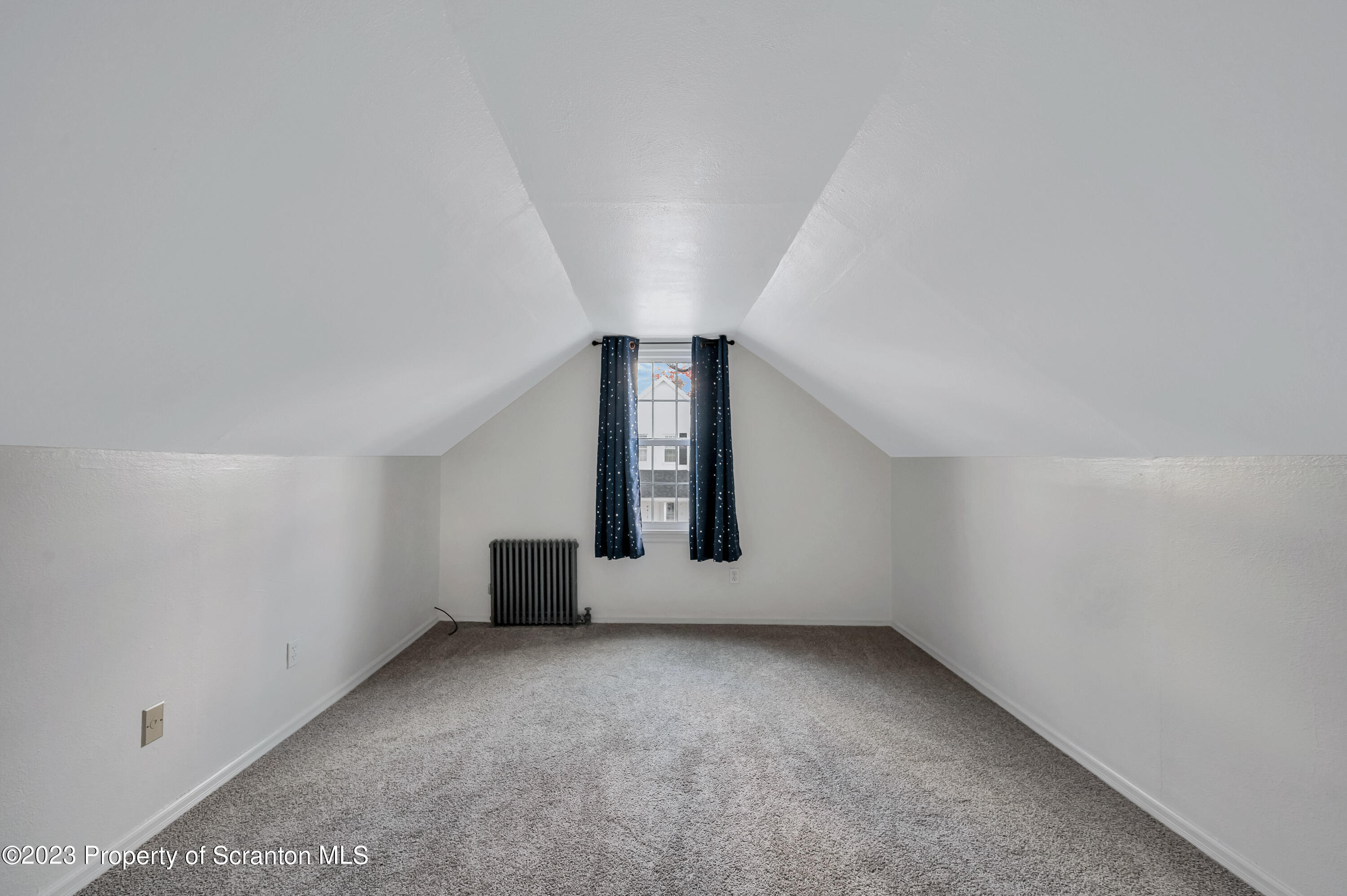 709 Meade Street Throop, PA 18512 - Photo 21 of 37 an empty room with windows