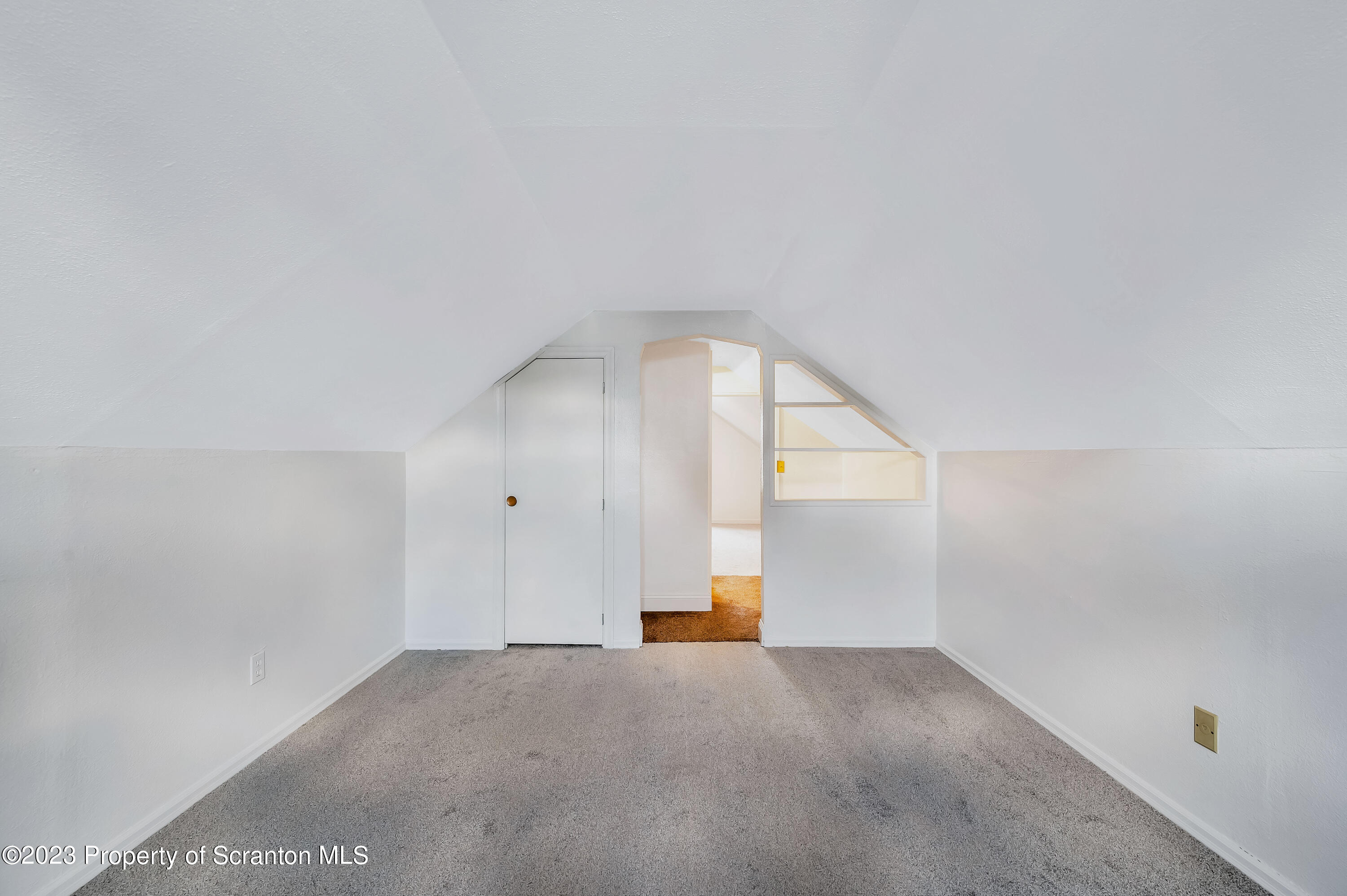 709 Meade Street Throop, PA 18512 - Photo 22 of 37 a view of an empty room with a window