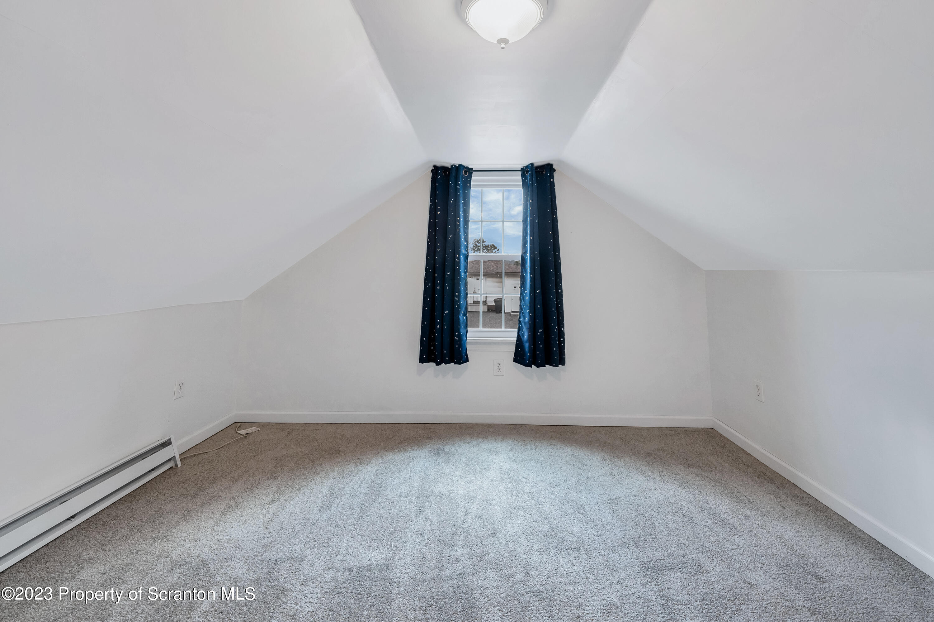 709 Meade Street Throop, PA 18512 - Photo 23 of 37 an empty room with a window