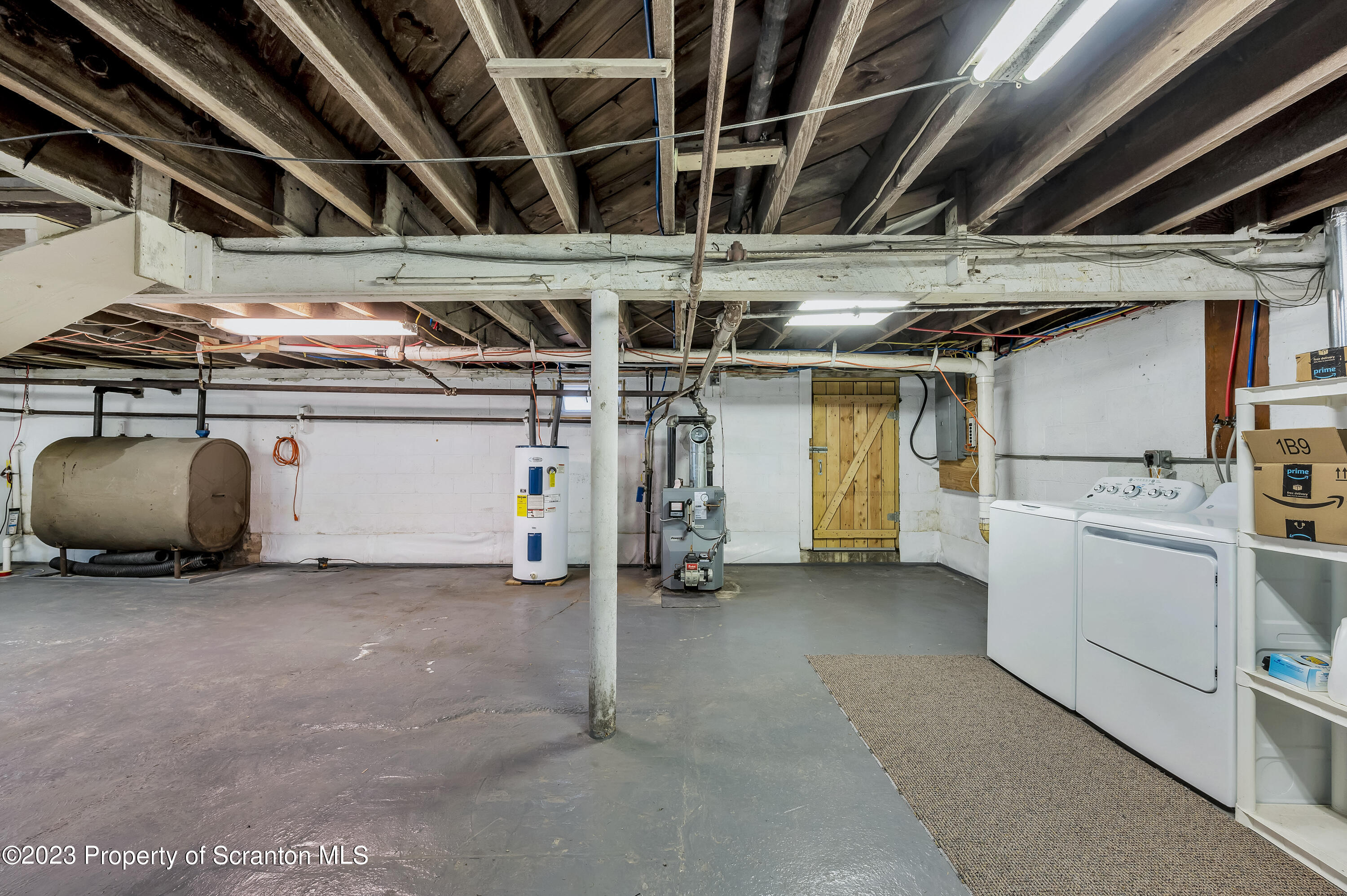 709 Meade Street Throop, PA 18512 - Photo 25 of 37 a utility room with dryer and washer