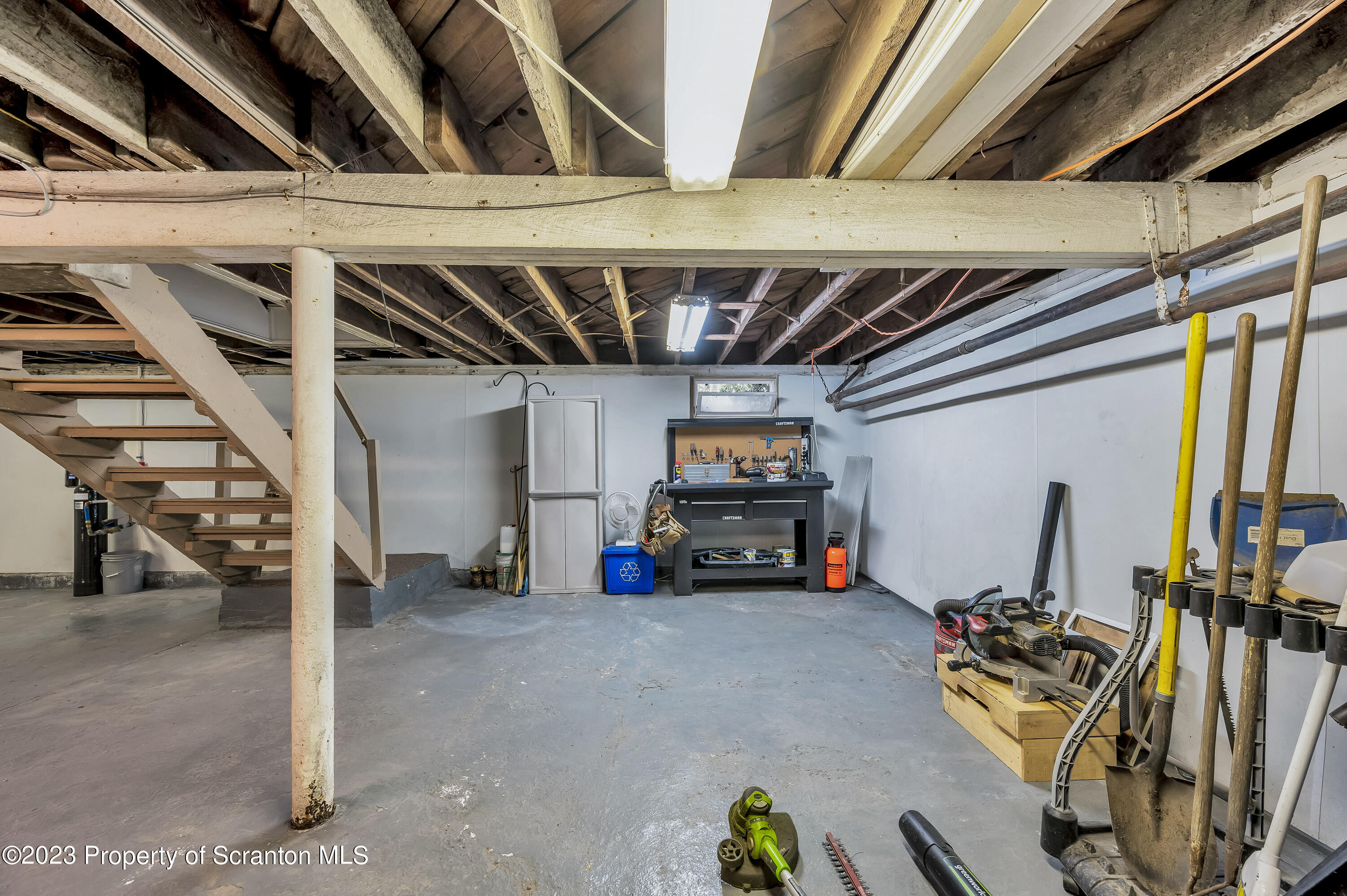 709 Meade Street Throop, PA 18512 - Photo 27 of 37 a view of a garage with cars