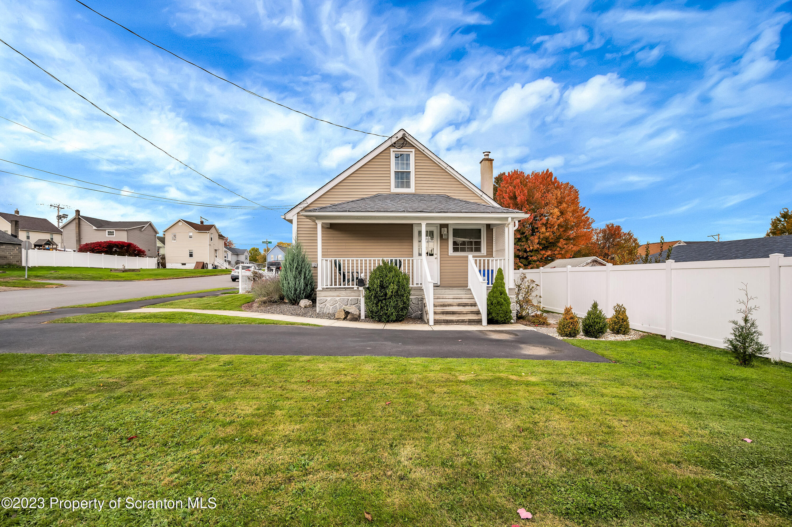 709 Meade Street Throop, PA 18512 - Photo 3 of 37 a front view of a house with yard and green space