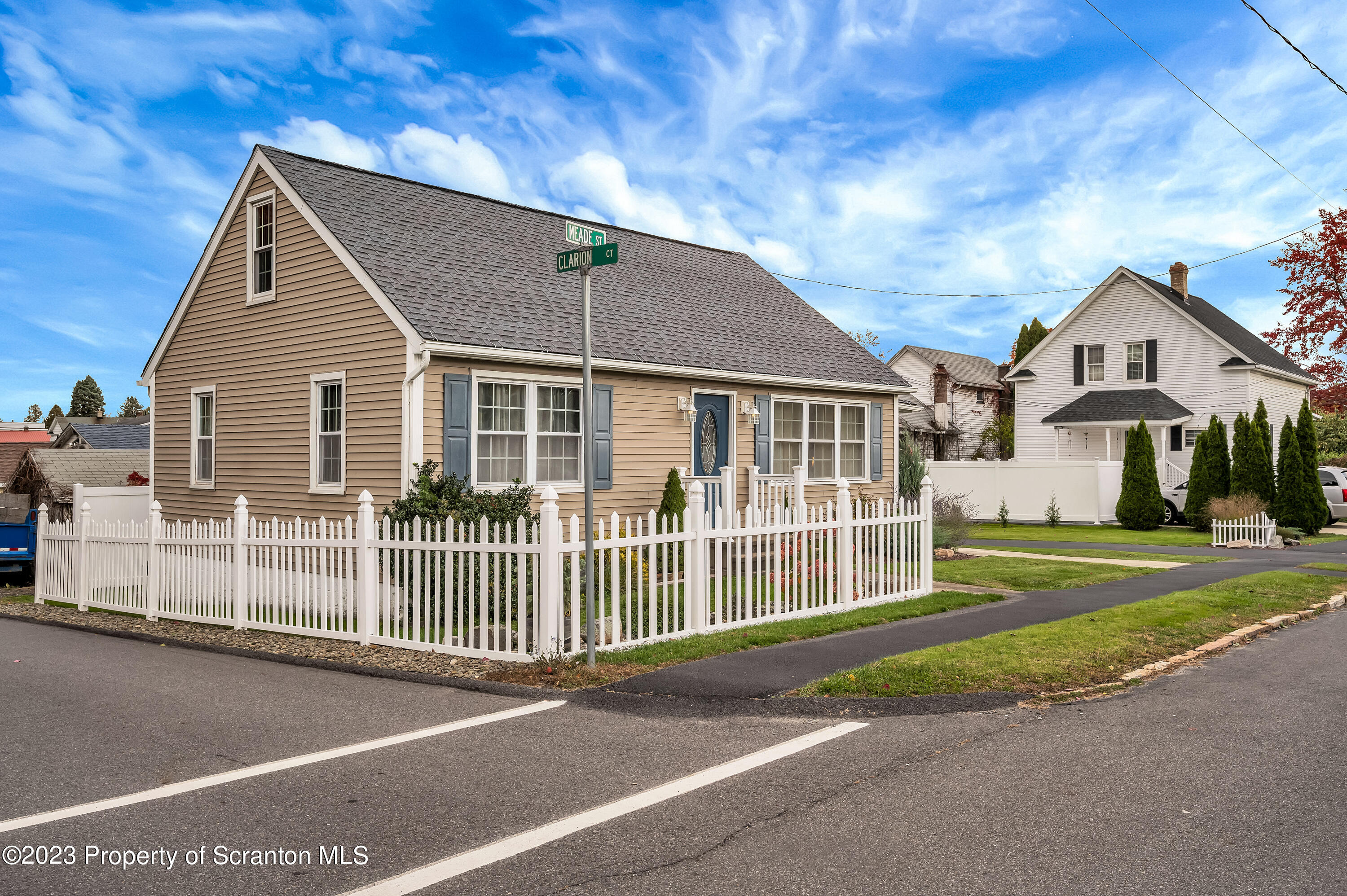 709 Meade Street Throop, PA 18512 - Photo 4 of 37 a view of a house with a yard and fence