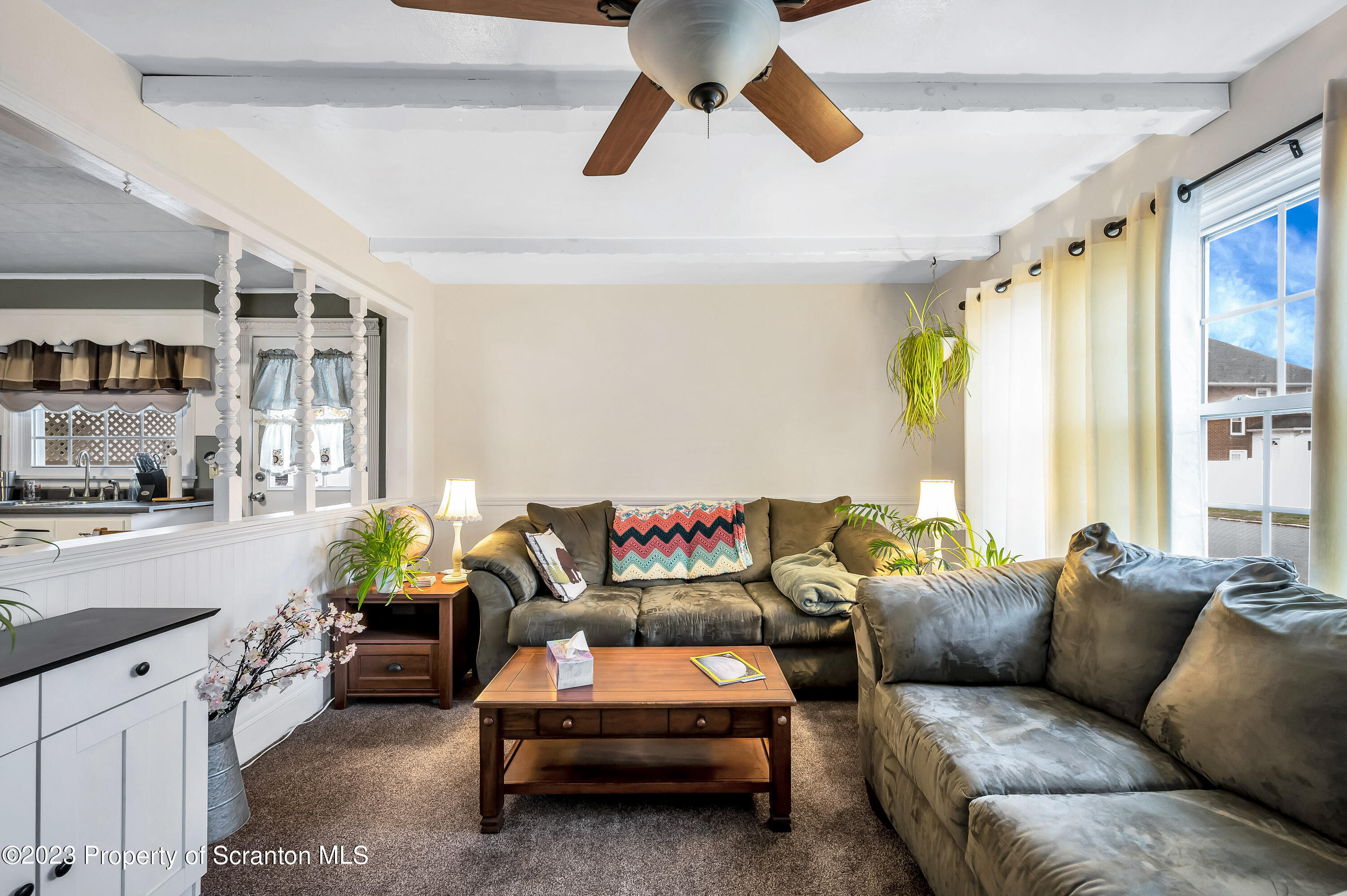 709 Meade Street Throop, PA 18512 - Photo 5 of 37 a living room with furniture and a window