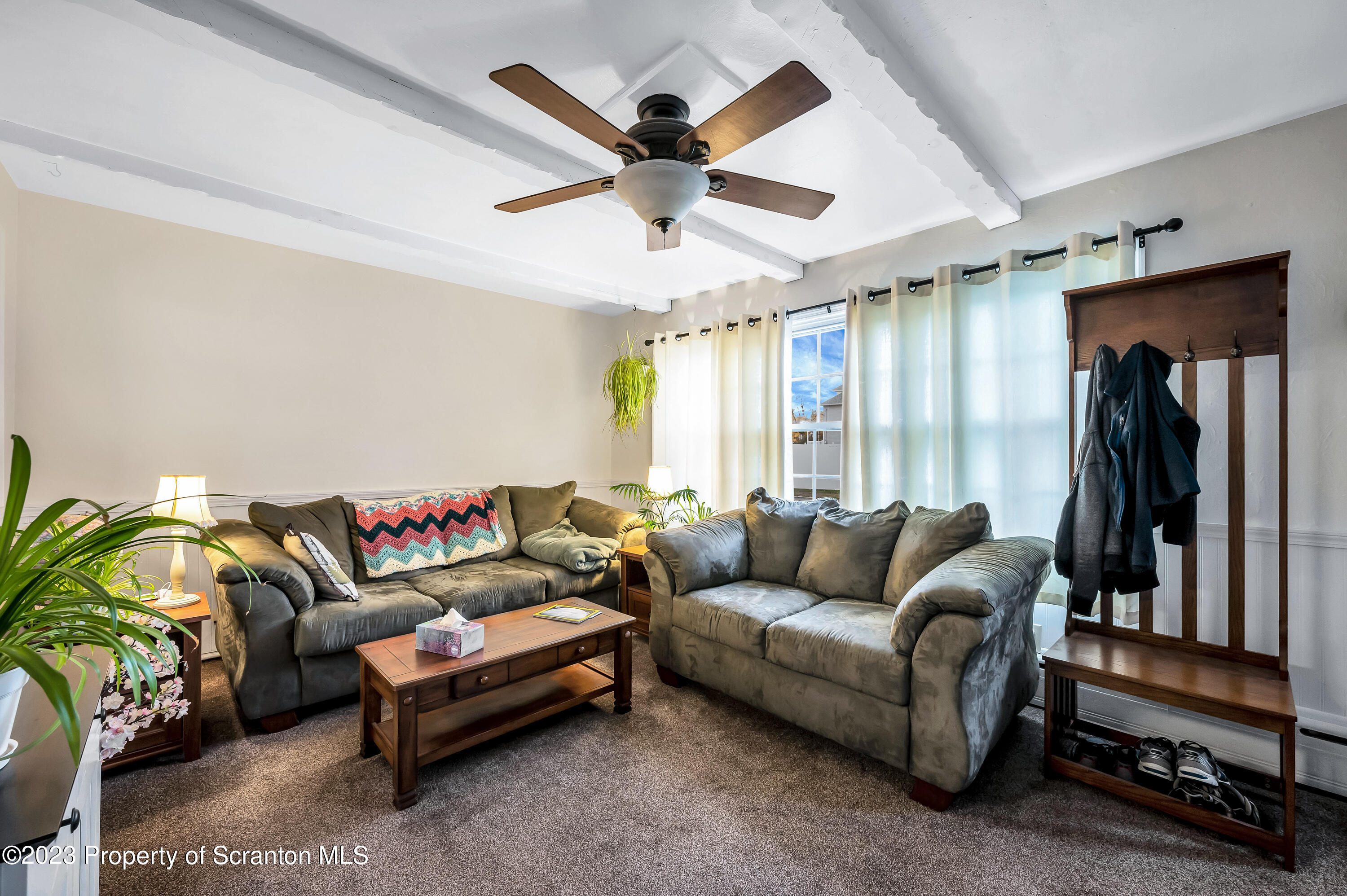 709 Meade Street Throop, PA 18512 - Photo 6 of 37 a living room with furniture and a large window