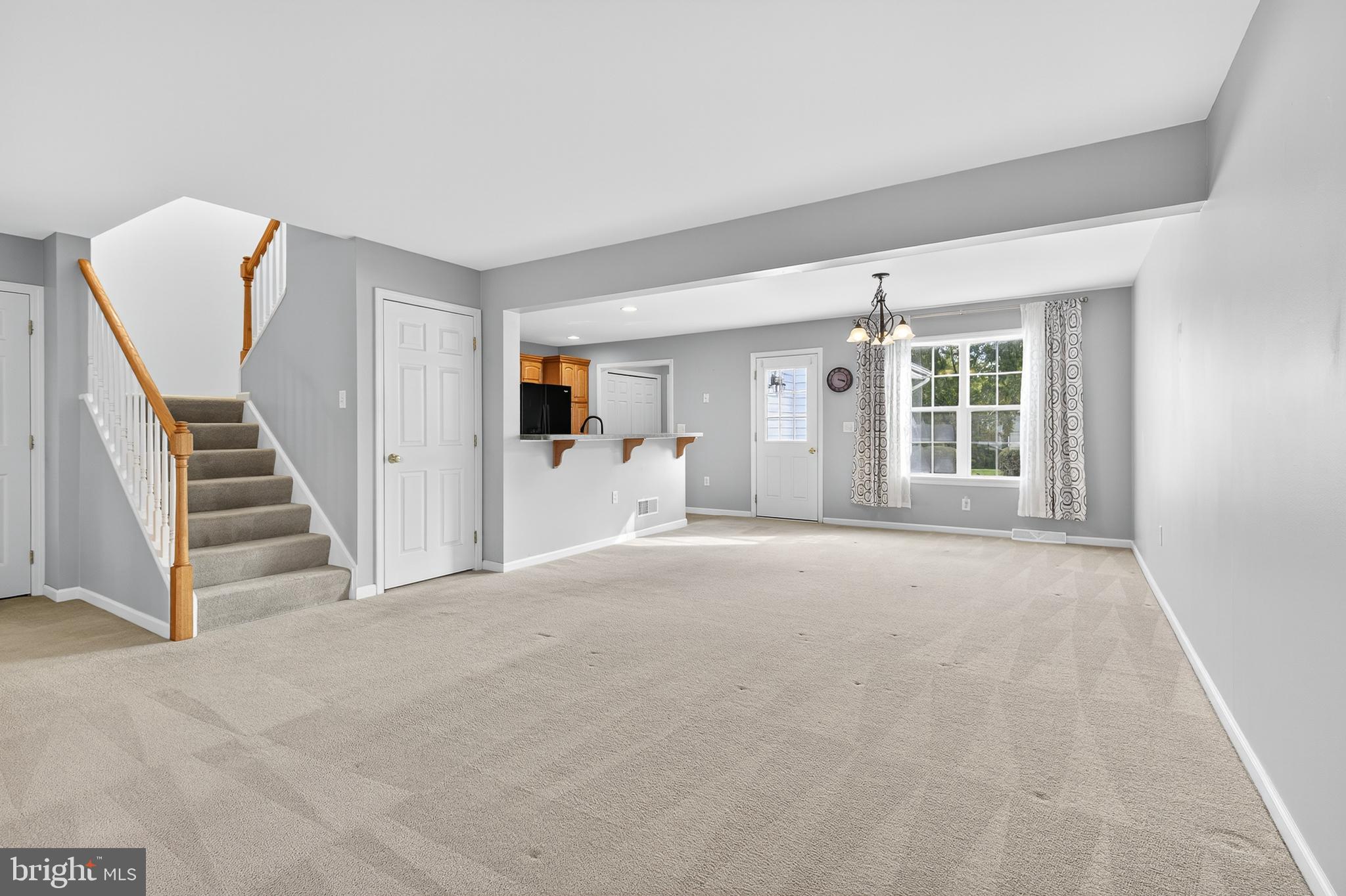 802 Wallingford Road Lititz, PA 17543 - Photo 23 of 23 a view of an empty room with stairs and a window