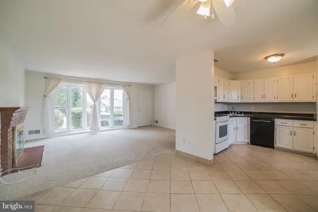 a view of a kitchen with a stove cabinets and a kitchen
