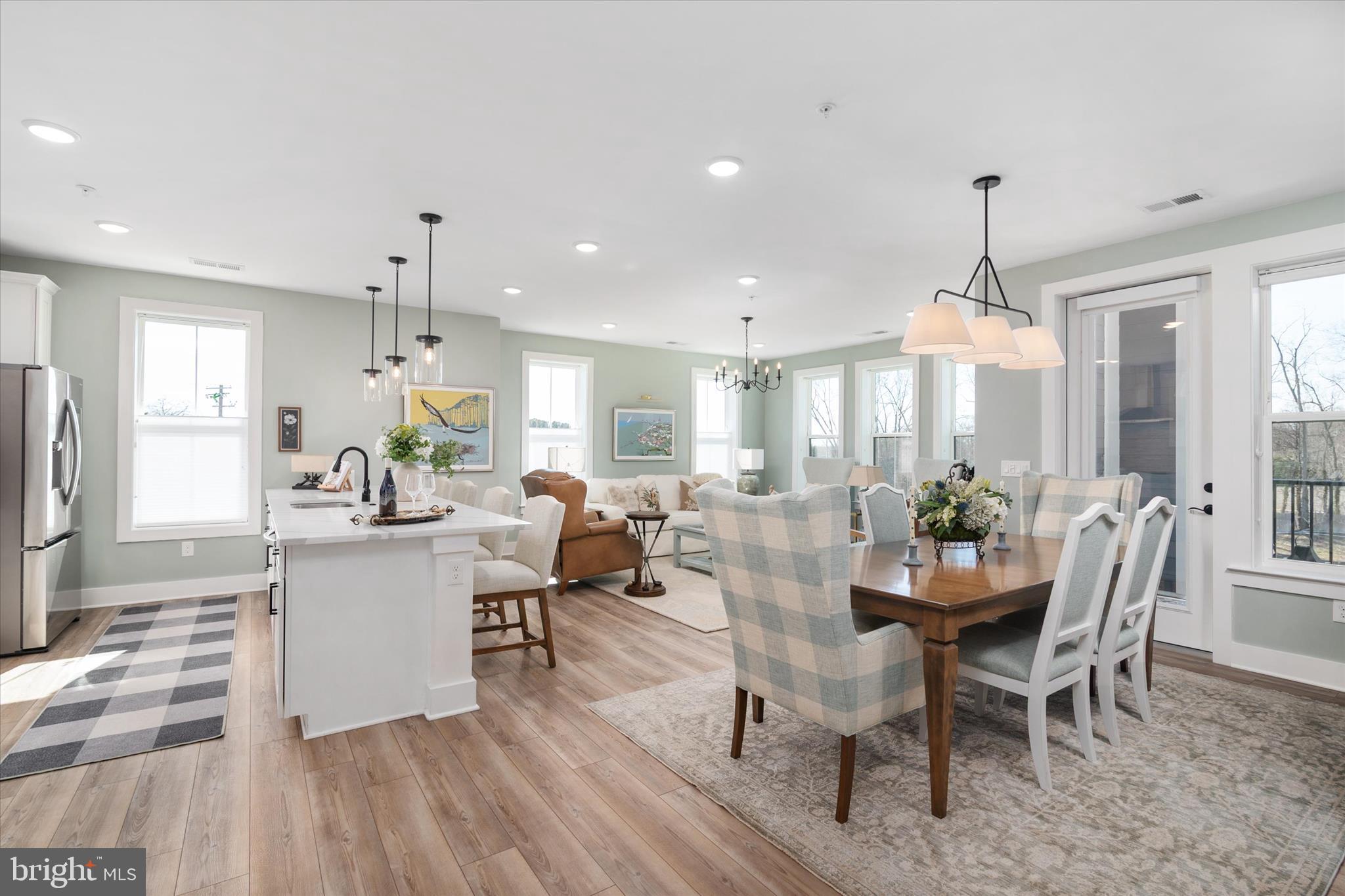 78 Old Mill Bottom Road North, Unit 211 Annapolis, MD 21409 - Photo 7 of 37 a view of a dining room with furniture window and wooden floor
