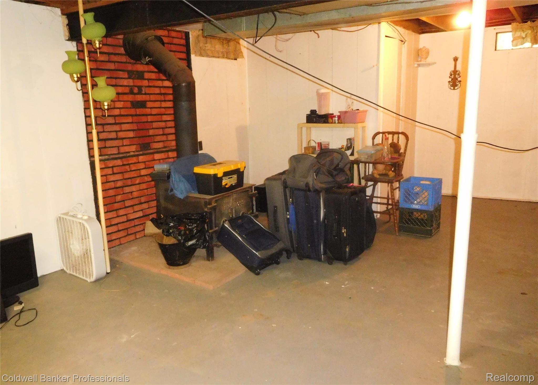 11425 Lytle Road Lennon, MI 48449 - Photo 20 of 29 North Side of Basement. Wood Stove is currently capped.