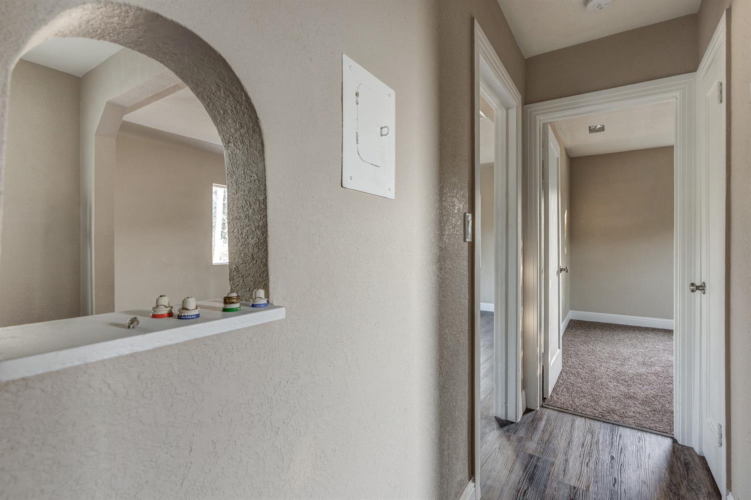 2520 P Street Merced, CA 95340 - Photo 14 of 23 a view of an empty room with mirror and a wooden floor