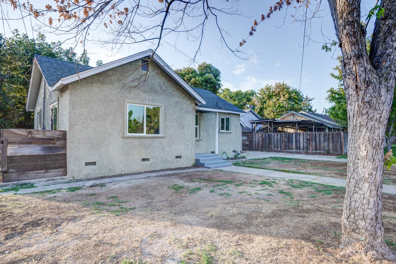 2520 P Street Merced, CA 95340 - Photo 4 of 23 a view of a house with a yard and tree s