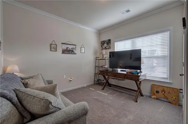 a kitchen with stainless steel appliances granite countertop wooden floors stove top oven with a dining table and chairs