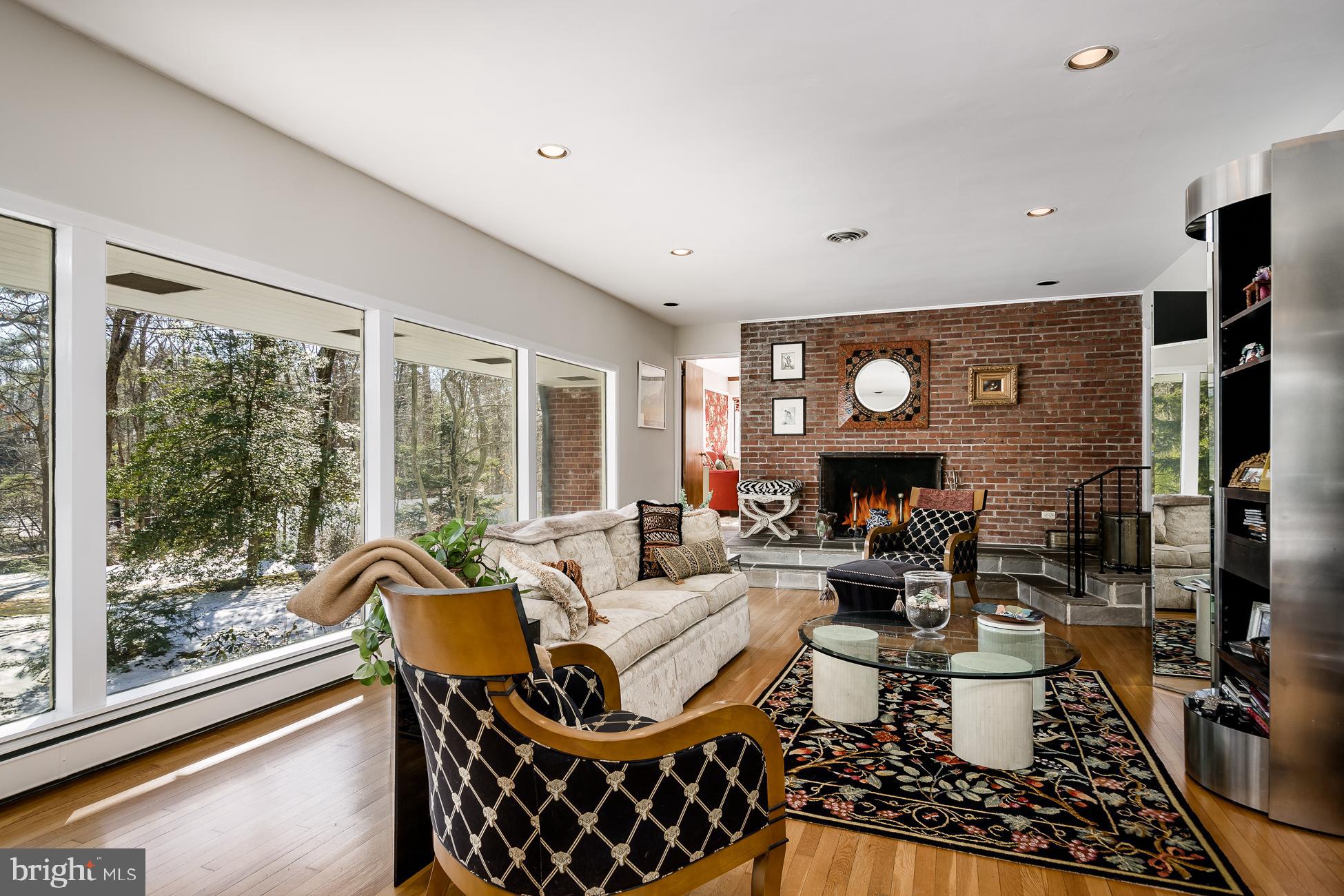 52 Winant Road Princeton, NJ 08540 - Photo 1 of 32 a living room with fireplace furniture and a large window