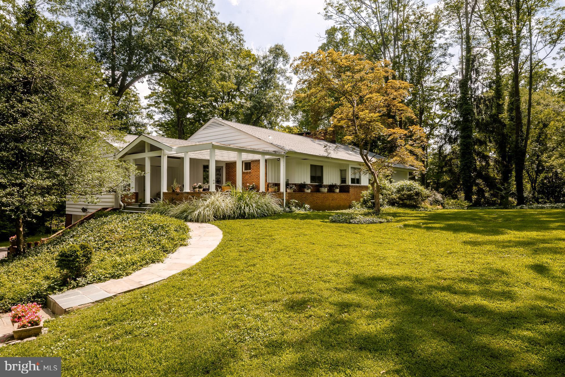 52 Winant Road Princeton, NJ 08540 - Photo 2 of 32 a front view of a house with swimming pool and porch