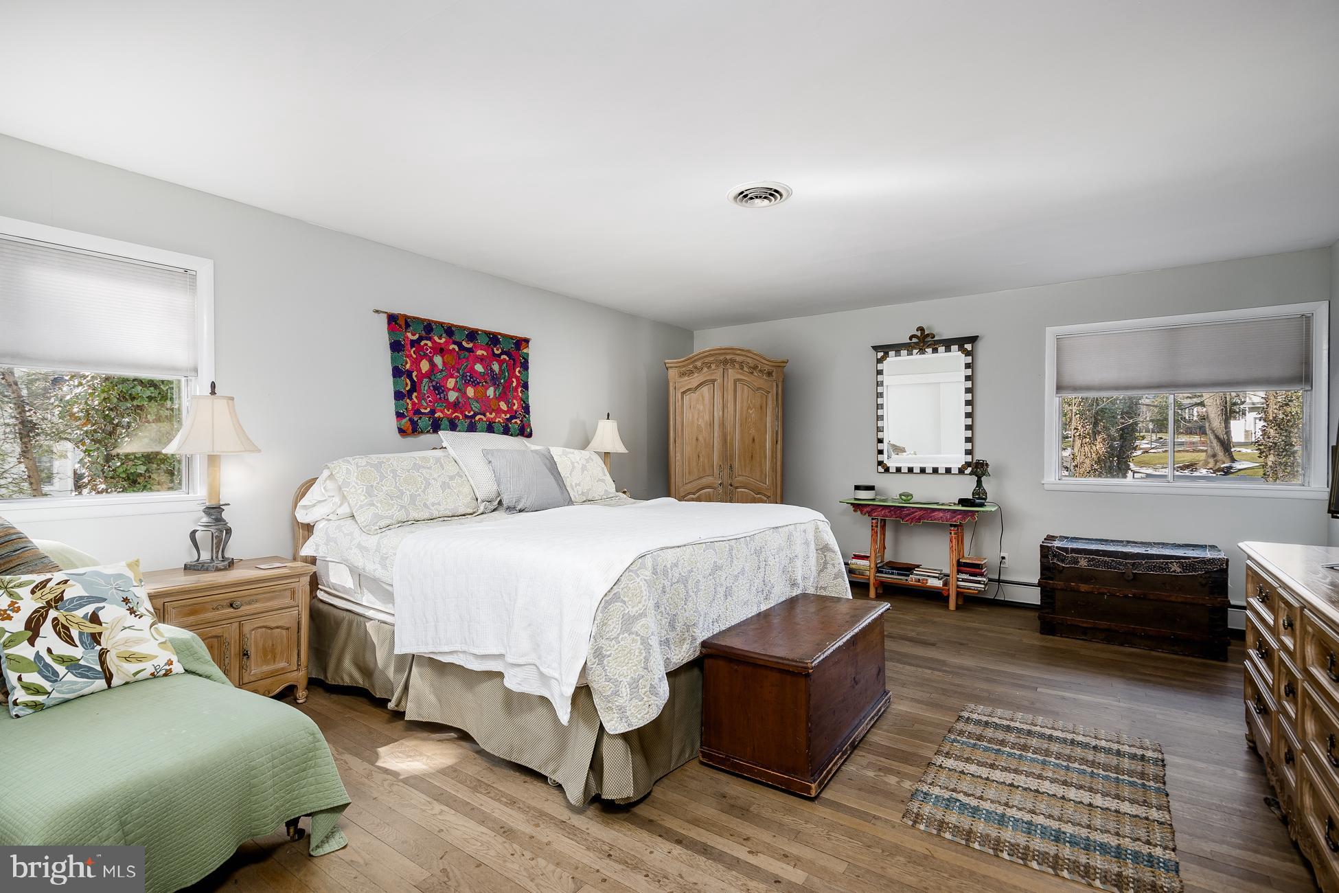 52 Winant Road Princeton, NJ 08540 - Photo 16 of 32 a spacious bedroom with a bed a dresser and a window