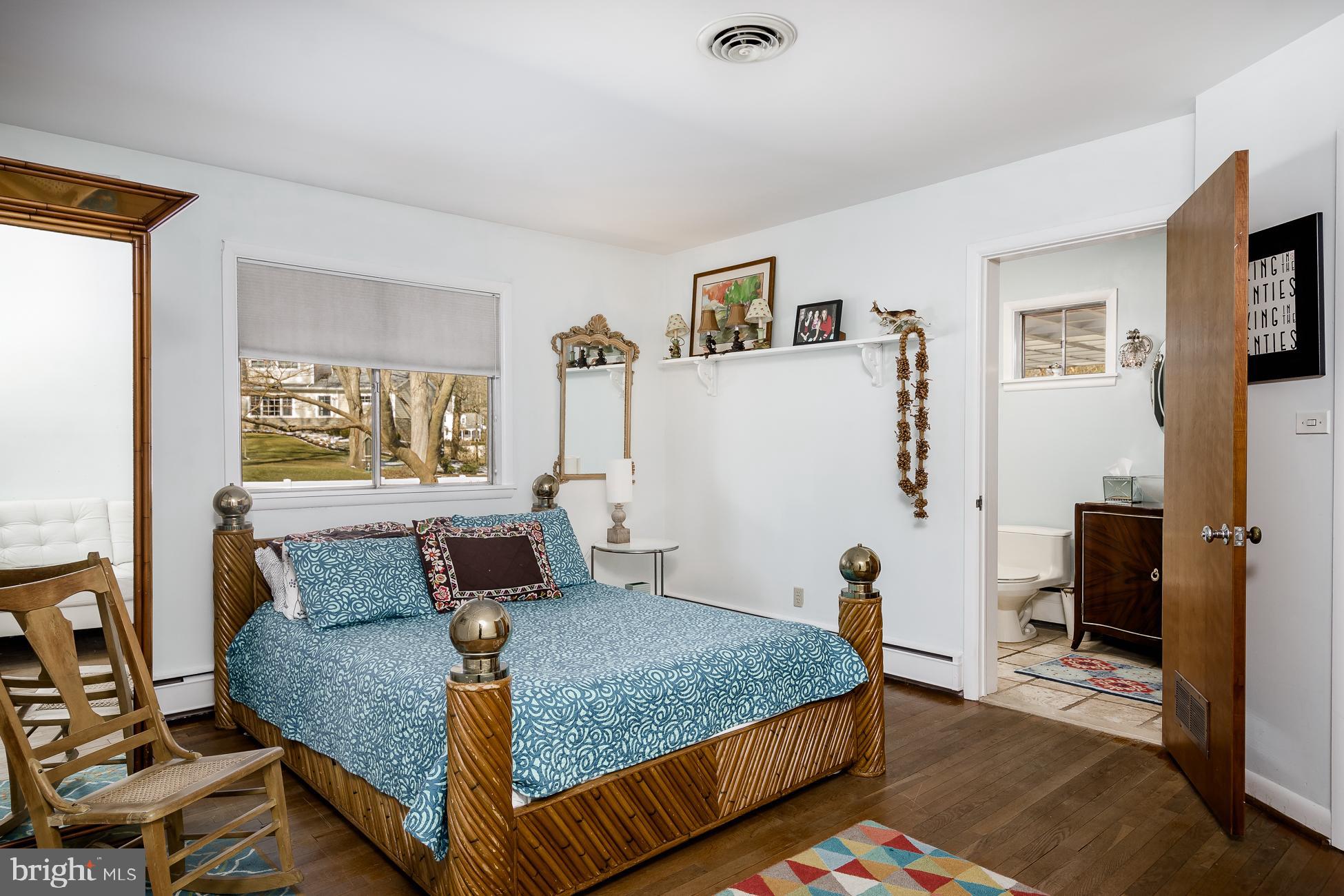 52 Winant Road Princeton, NJ 08540 - Photo 18 of 32 a bedroom with a bed and wooden floor