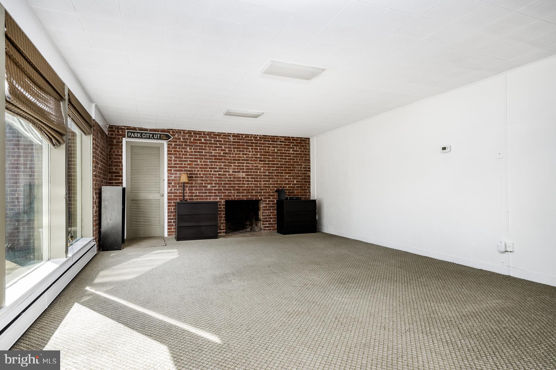 52 Winant Road Princeton, NJ 08540 - Photo 23 of 32 an empty room with fireplace