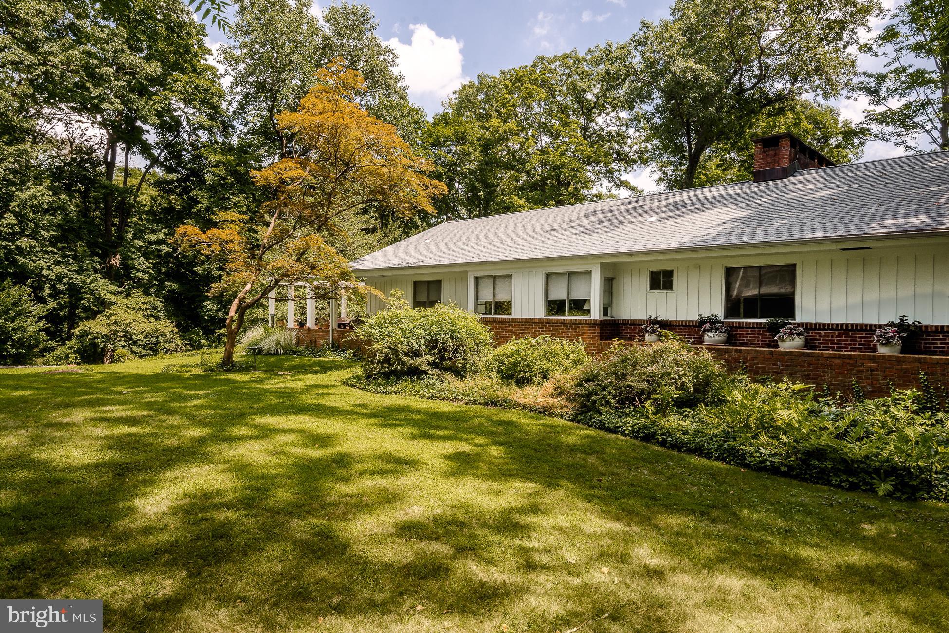 52 Winant Road Princeton, NJ 08540 - Photo 25 of 32 a front view of a house with a garden
