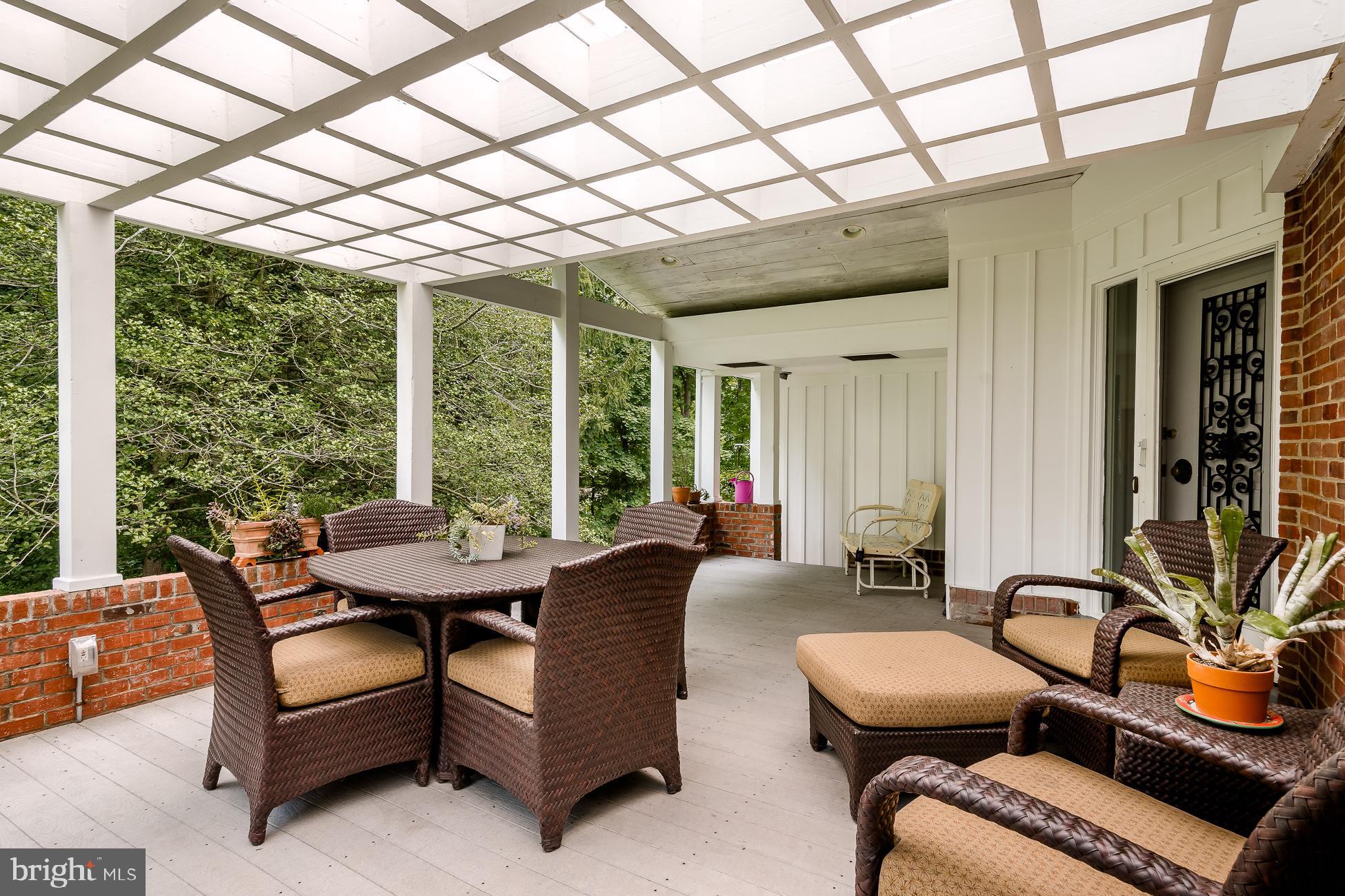 52 Winant Road Princeton, NJ 08540 - Photo 4 of 32 a view of a patio with a table and chairs